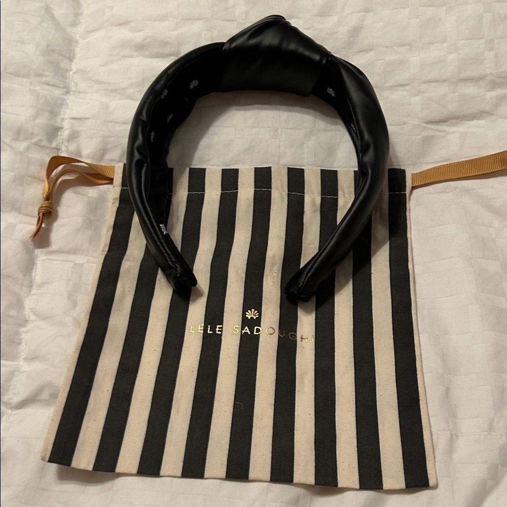 Classic black leather Lele Sadoughi headband with dust bag
